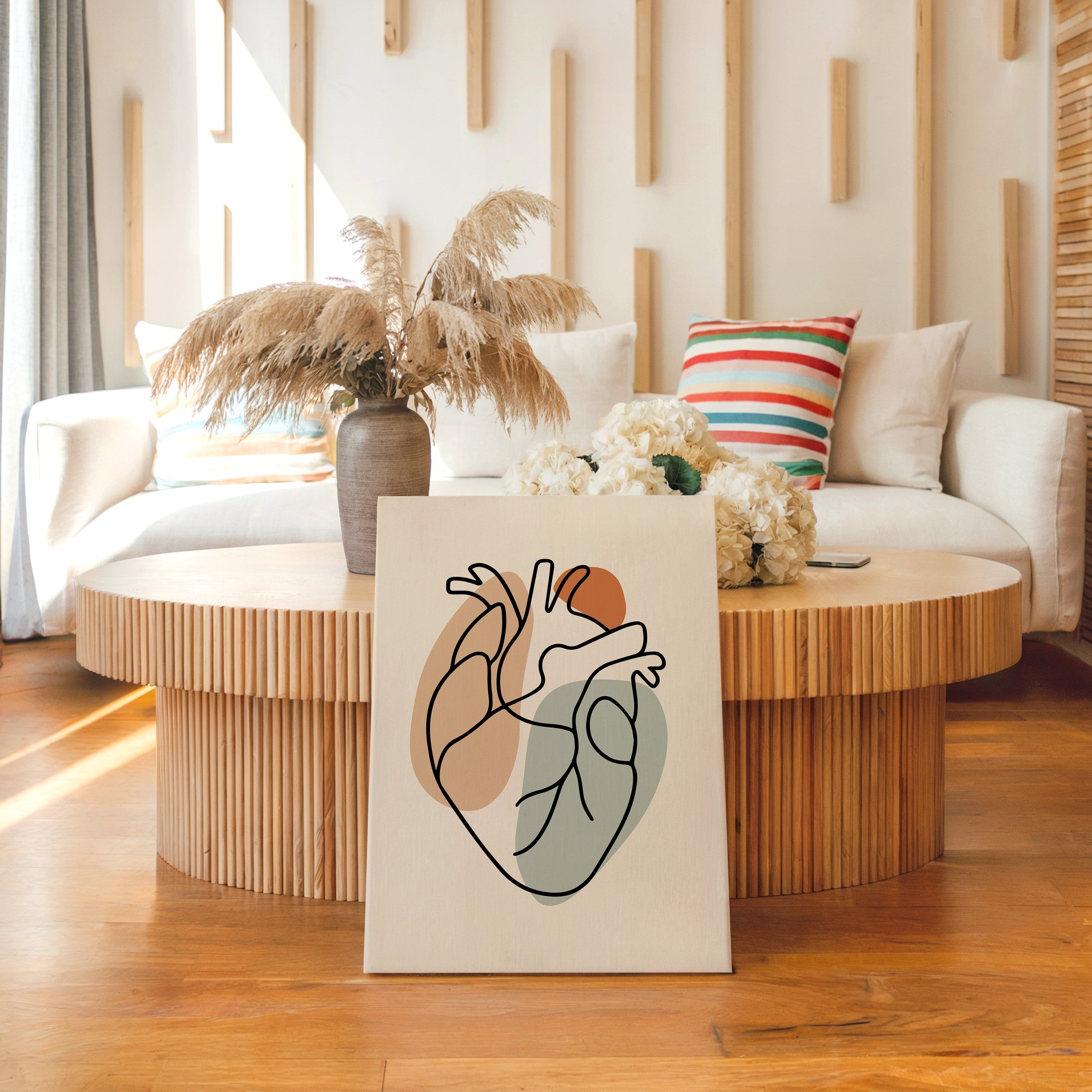 One line heart artwork on a thick unframed canvas beside a window