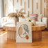 Minimalist kidney line art displayed in a neutral living room.