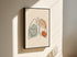 One line lungs artwork in a black frame on a light wall