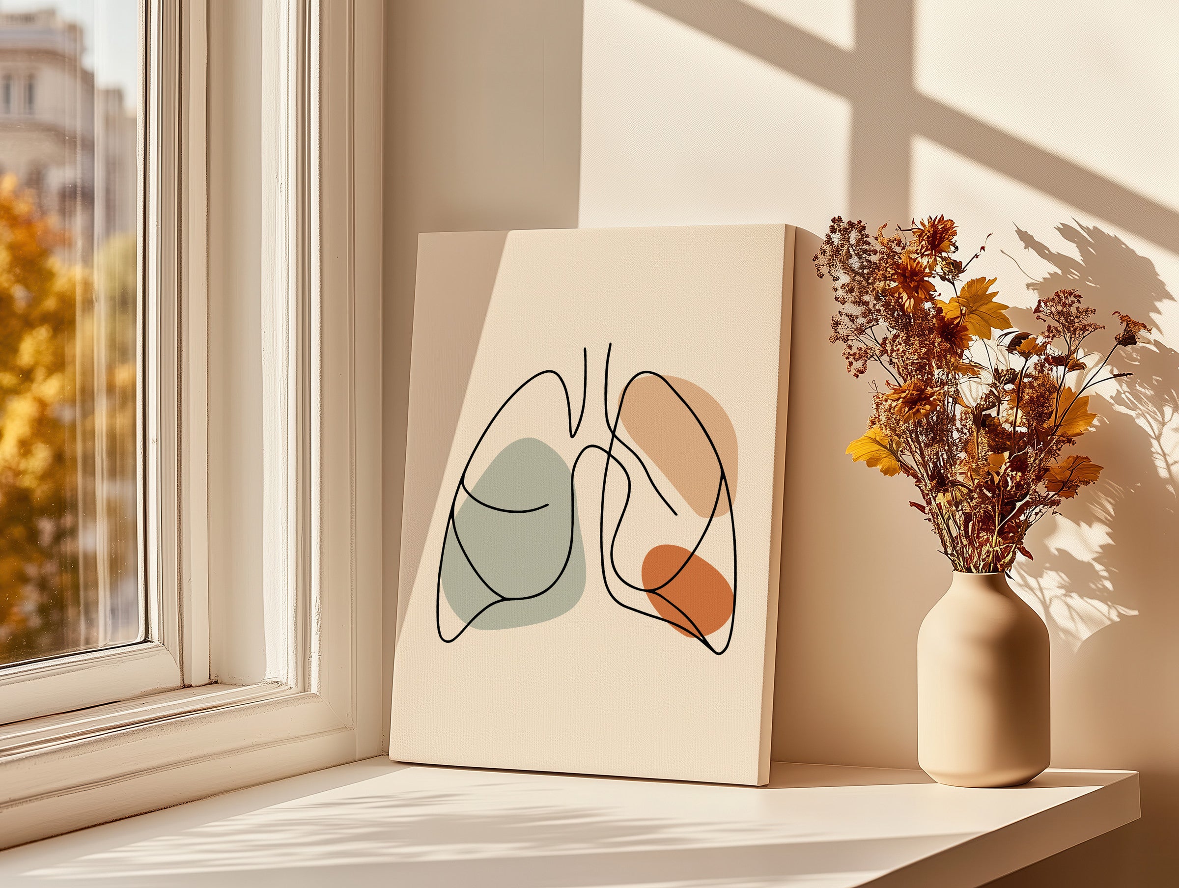 One line lungs artwork on a thick unframed canvas leaning by a window