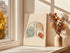 One line lungs artwork on a thick unframed canvas leaning by a window