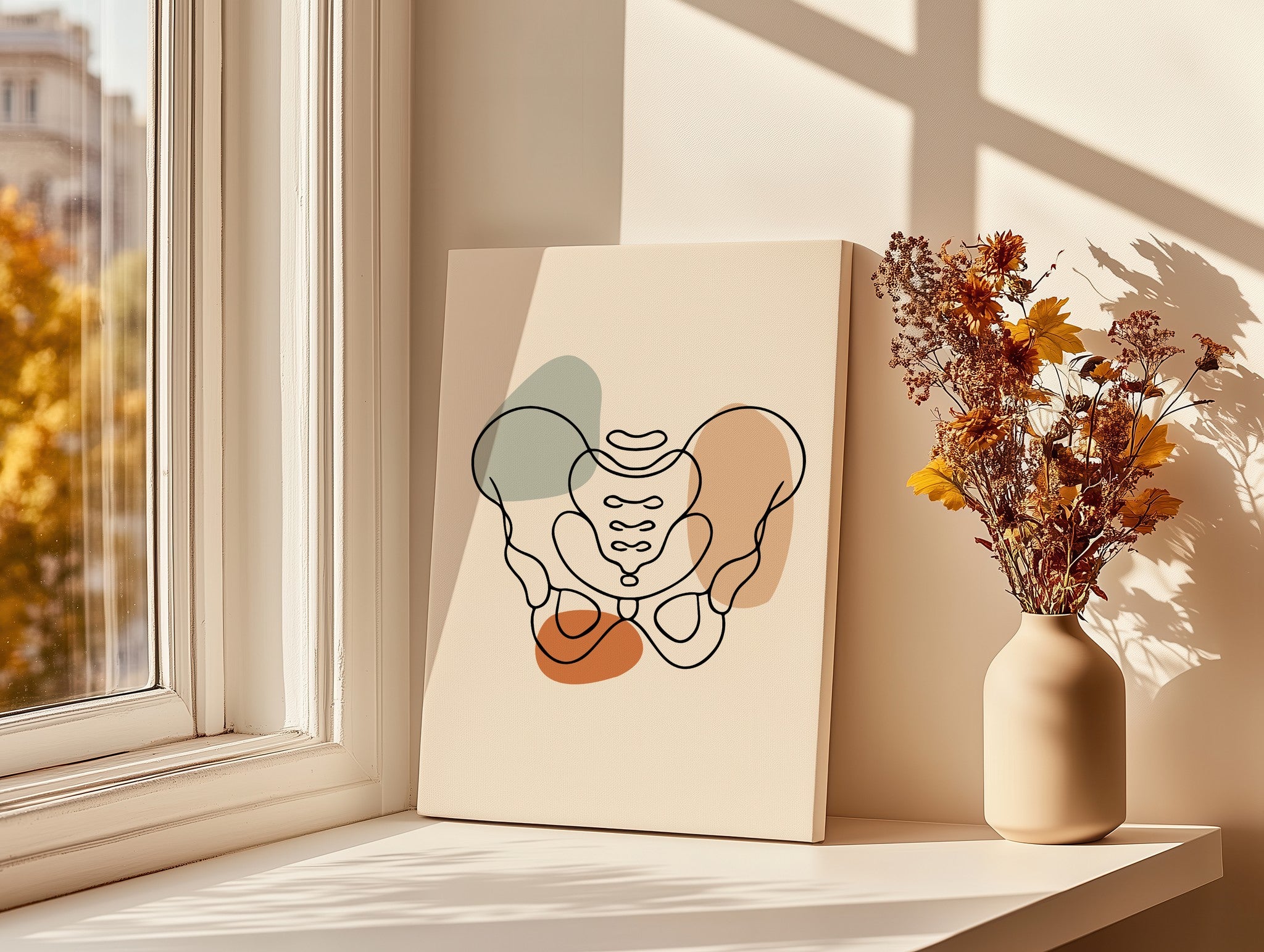 Pelvis line art canvas beside a vase of dried flowers on a sunny windowsill.
