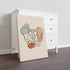 Pelvis line art on stretched canvas without an outer frame, leaning against a white dresser.
