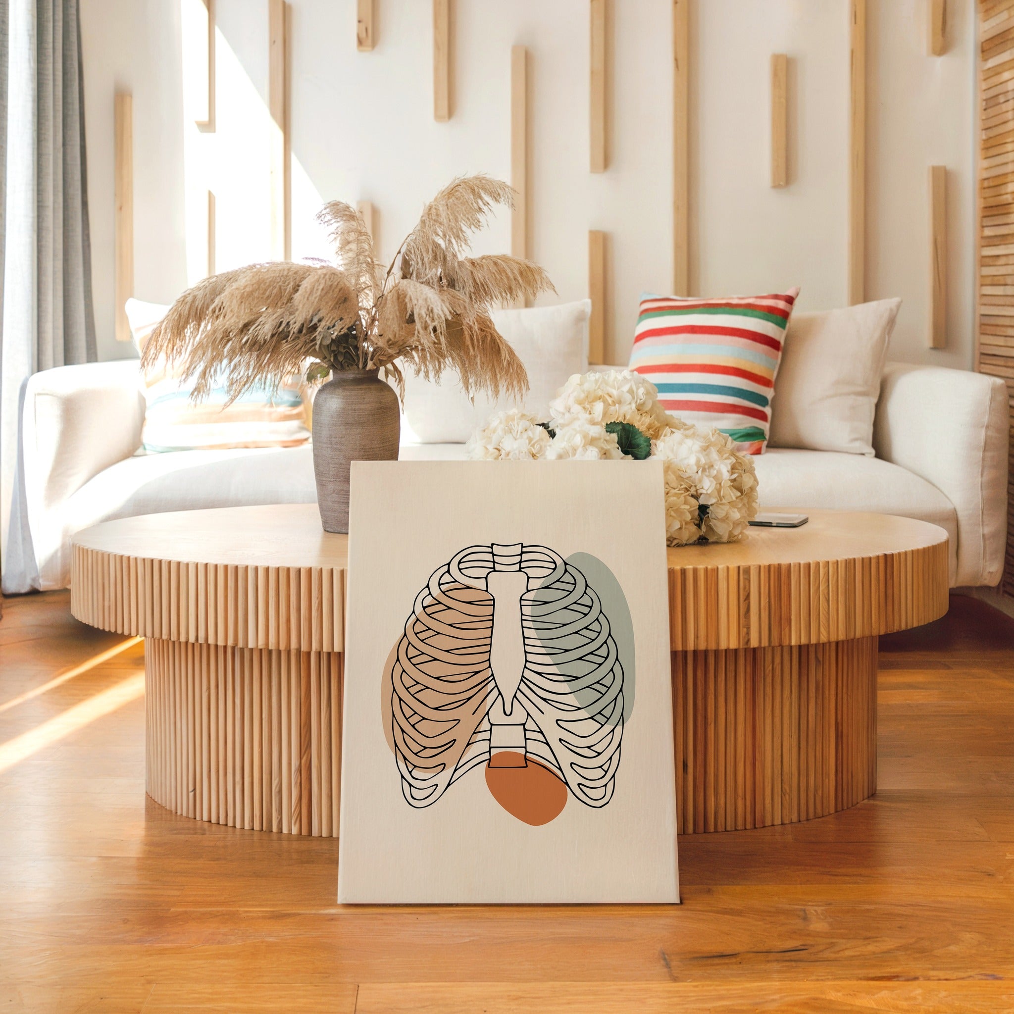 Minimalist rib cage line art displayed in a neutral living room.