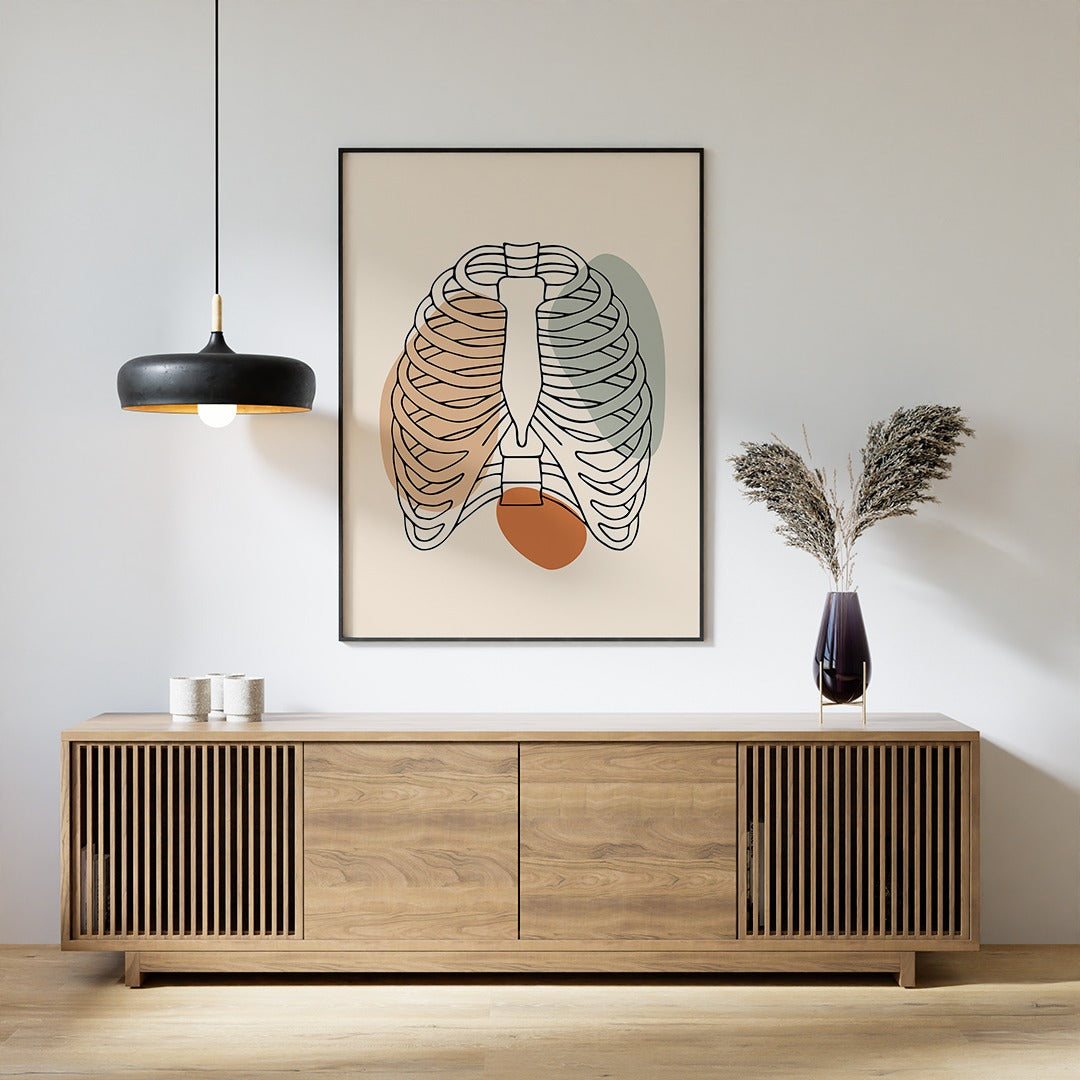 Minimalist rib cage line art in a room above a sideboard.