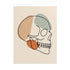 Minimalist skull line art as an unframed paper print on a wooden surface.