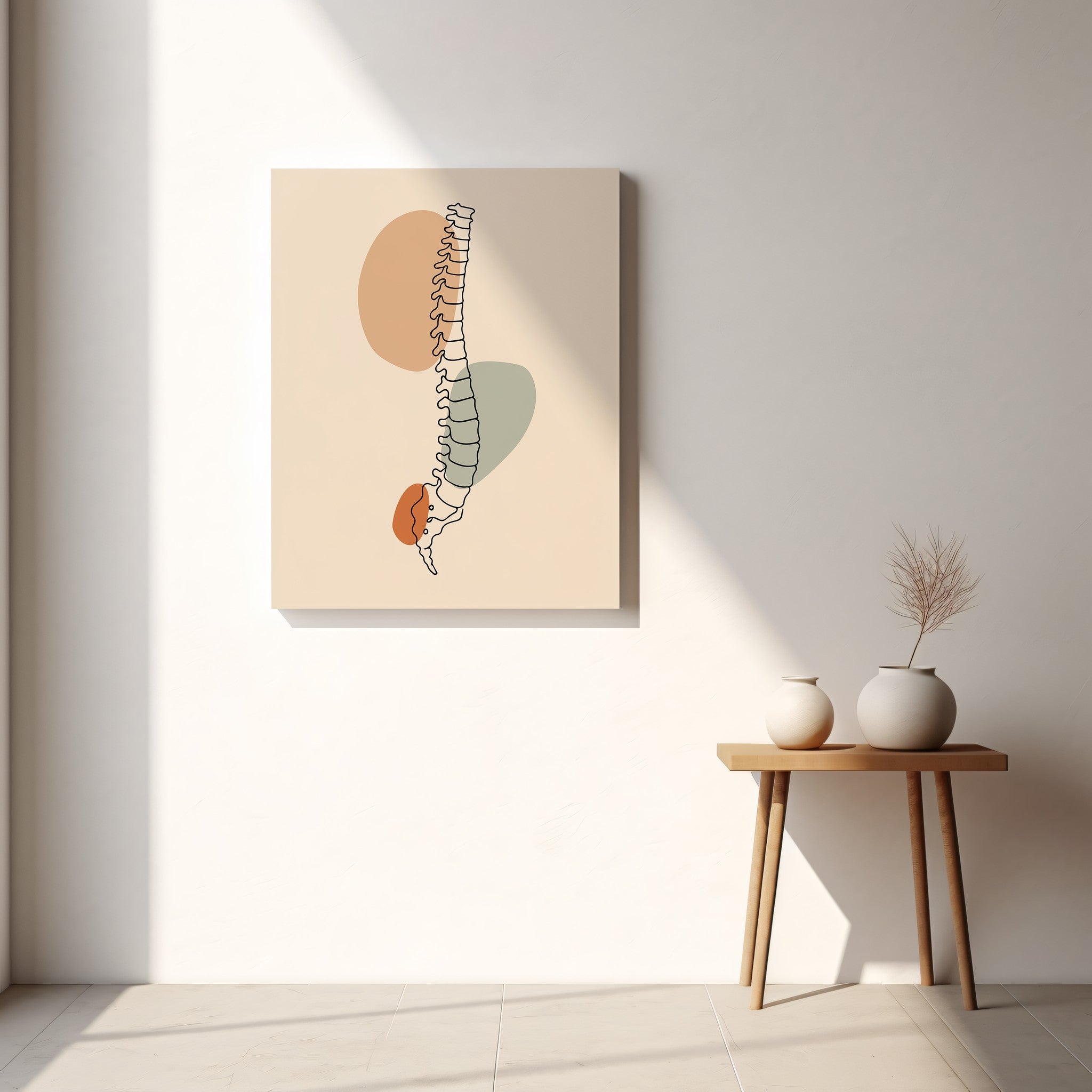 Minimalist spine canvas hanging above a small wooden table in a light neutral room.